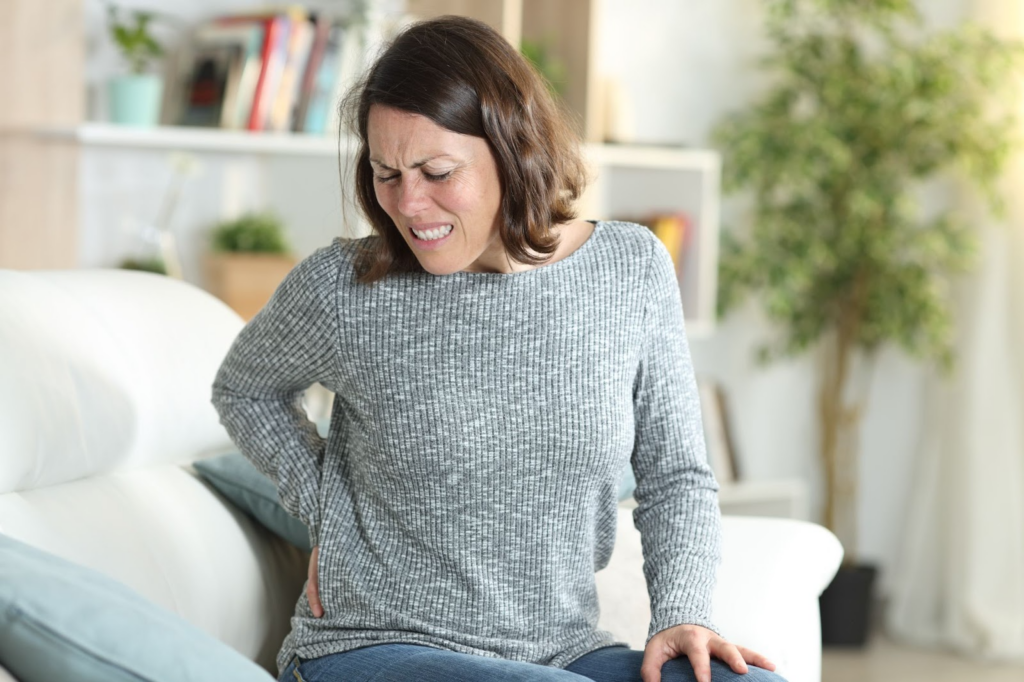 woman aching because of lower back pain